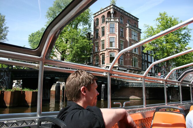 Amsterdam 1h Canal Cruise by Semi-Open Boat with Audio Guide - From Centraal Station to the canal belt: why the timing works