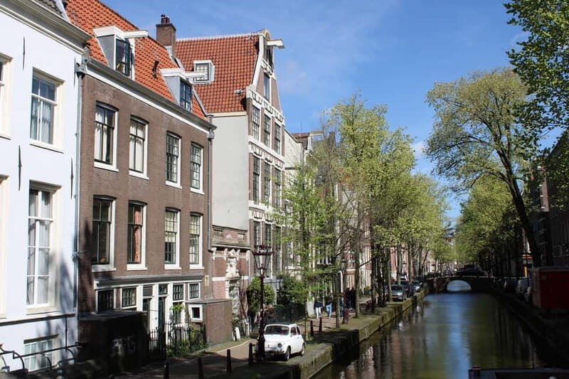 Amsterdam: 2-hour History & Culture tour with a Local - Canals, UNESCO context, WWII impact, and the bike story you can’t unsee