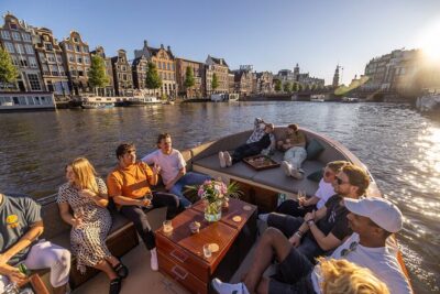 Amsterdam 2 Hour Small-Group Canal Cruise with Dutch Snacks & Bar - The Ride Experience: Cushioned Seating, Snacks, and a Bar If You Want It