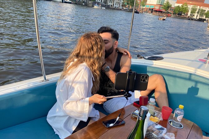 Amsterdam 90-min Private Canal Cruise with Live Guide and Drinks - Your private boat on Amsterdam’s canals: what the experience feels like
