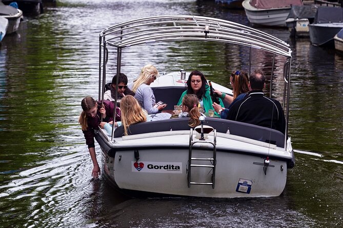 Amsterdam 90-min Private Canal Cruise with Live Guide and Drinks - Dancing Houses and Monet’s canal: whimsy and art in the same ride