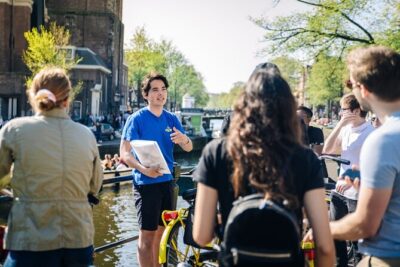 Amsterdam Anne Frank and Jewish History E Bike Tour - Nieuwezijds Kolk: starting at an old Amsterdam meeting point