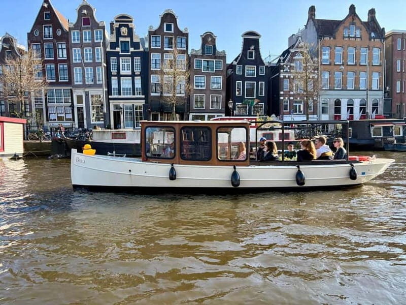 Amsterdam Canal Boat Tour with Live Guide - Weather reality: rain runs, but your clothing still matters