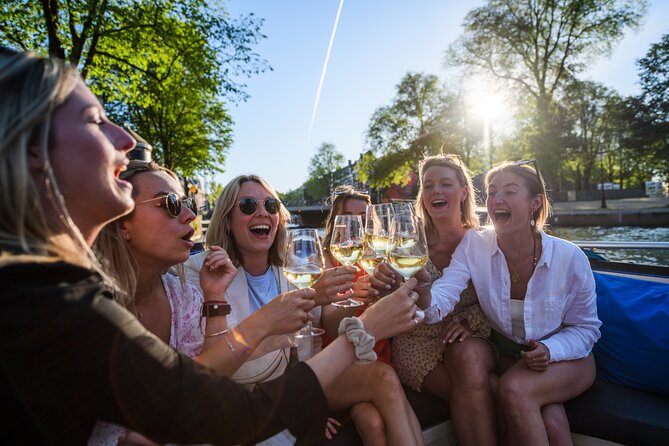 Amsterdam: Canal Booze Cruise with Unlimited Drinks Option - De Wallen and Dam Square: how the Red Light District fits in