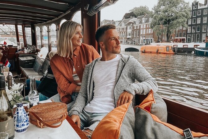 Amsterdam Canal Cruise in Classic Salon Boat With Drinks and Cheese - Cold water reality check: clothing, the step into the boat, and comfort