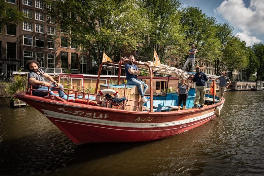Amsterdam: Canal Cruise on a Wooden Refugee Boat - The stop that isn’t a stop: conversation time on open water