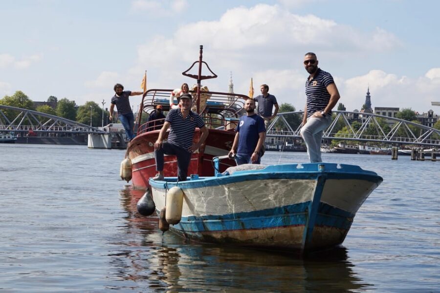 Amsterdam: Canal Cruise on a Wooden Refugee Boat - What to bring so the open boat feels comfortable