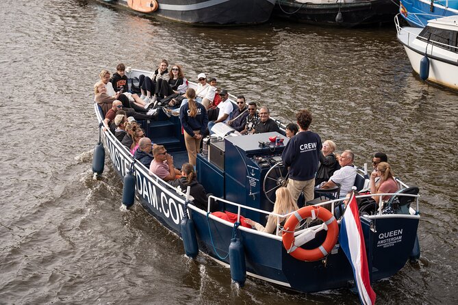 Amsterdam Canal Cruise with Live guide & Two drinks - Central St. - Rain, photos, and how to get the best experience on deck