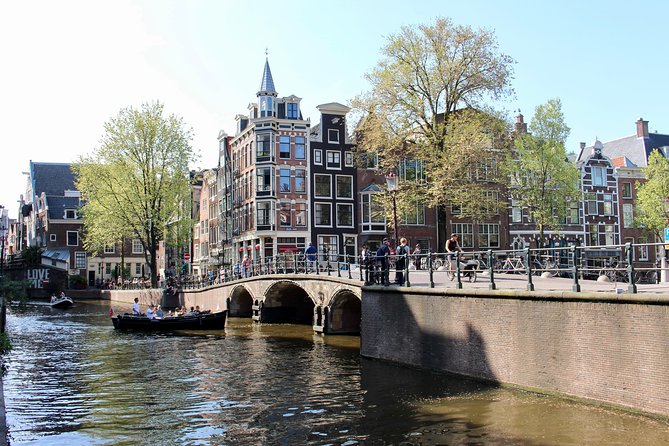 Amsterdam Canal Tour by Open Boat – 90 min Small Group Experience - The Route: Amstel Highlights, the Red-Light Border, and Iconic Canal Stops