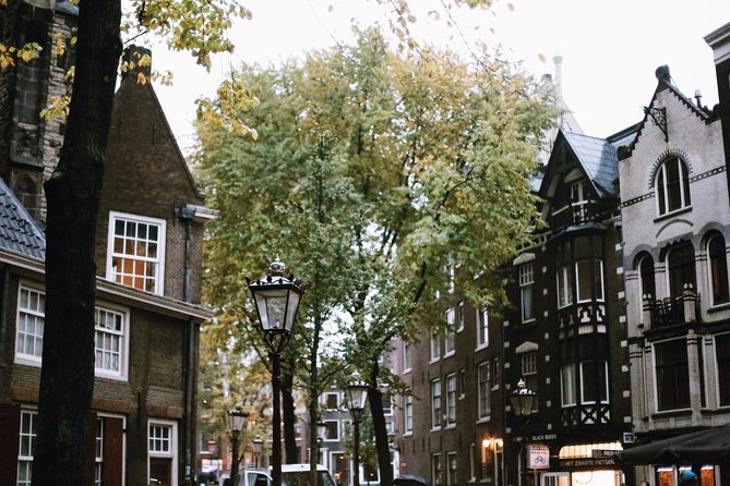Amsterdam City Center Guided Walking Tour Semi-Private 12ppl Max - Churches, a Courtyard Peace Pause, and Dam Square’s Power