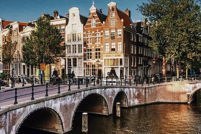 Amsterdam City Center & History - Exclusive Guided Walking Tour - From St. Nicholas Basilica to the Weeping Tower: faith and farewell-by-ship