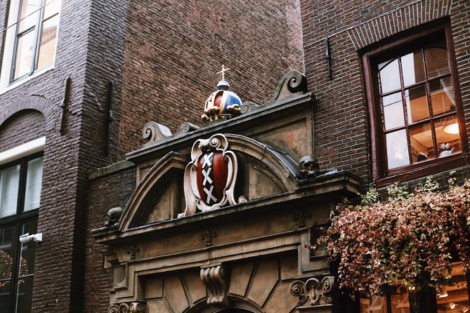 Amsterdam City Center & History - Exclusive Guided Walking Tour - Zeedijk, old sea dike engineering, and Amsterdam’s lock-bridge charm