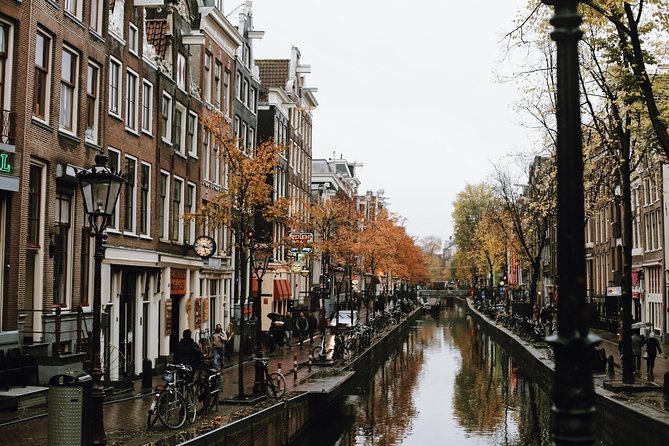 Amsterdam City Center & History - Exclusive Guided Walking Tour - Nieuwmarkt and De Waag: commerce, guild power, and a city-gate survivor