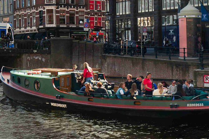 Amsterdam Classic Canal Cruise on a Historic Tugboat - Guides, narration, and what you should expect from the people onboard