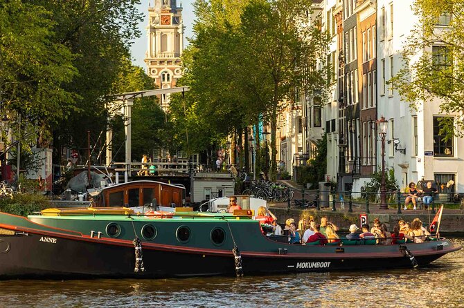 Amsterdam Classic Canal Cruise on a Historic Tugboat - The boat experience: comfort, views, and onboard drinks