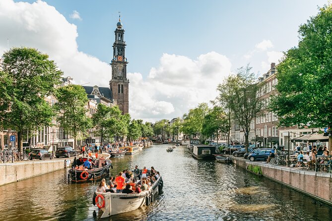 Amsterdam Classic Saloon Boat Canal Cruise with Live Guide - Weather-dependent boat comfort: open air or classic saloon seating