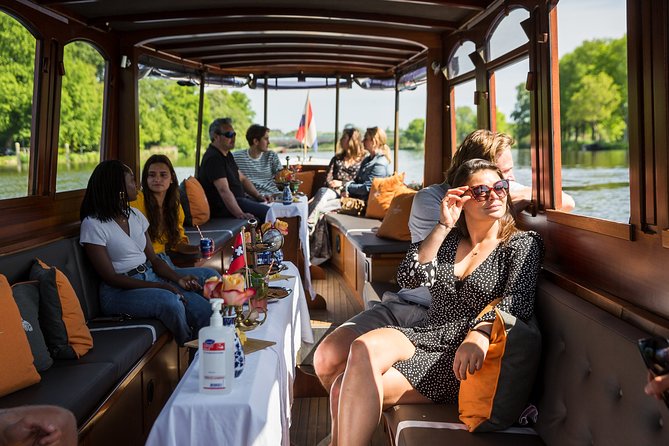 Amsterdam Classic Saloon Boat Cruise with Drinks and Cheese - Westerkerk and Carré: churches and culture along the way