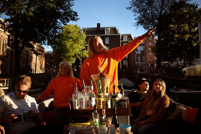 Amsterdam Evening Canal Cruise with Live Guide and Onboard Bar - Western Church and Carré: seeing famous buildings without the ticket line