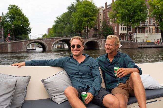 Amsterdam: Evening Candle Light Cruise With Wine & Cheese - The 1-hour route: Red Light District, NEMO, Herengracht, Seven Bridges