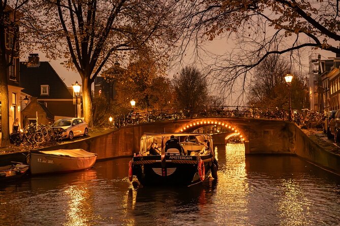 Amsterdam Evening (Sunset) Canal Cruise with optional drinks - Sunset Moments and the Wooden Bridge Legend in Evening Lights