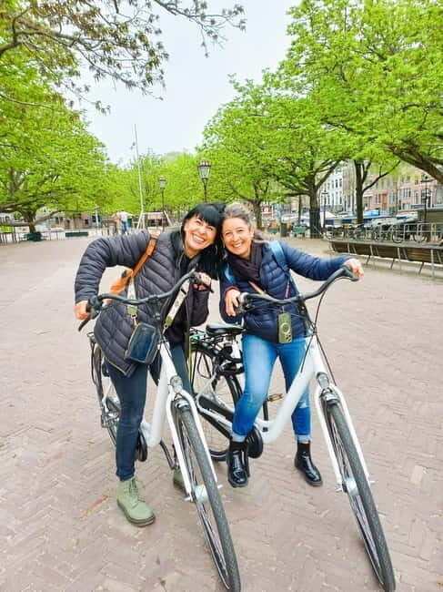 Amsterdam: Guided bike tour in French off the beaten track - Entrepotdok: Canal-Side Amsterdam and Everyday-City Details