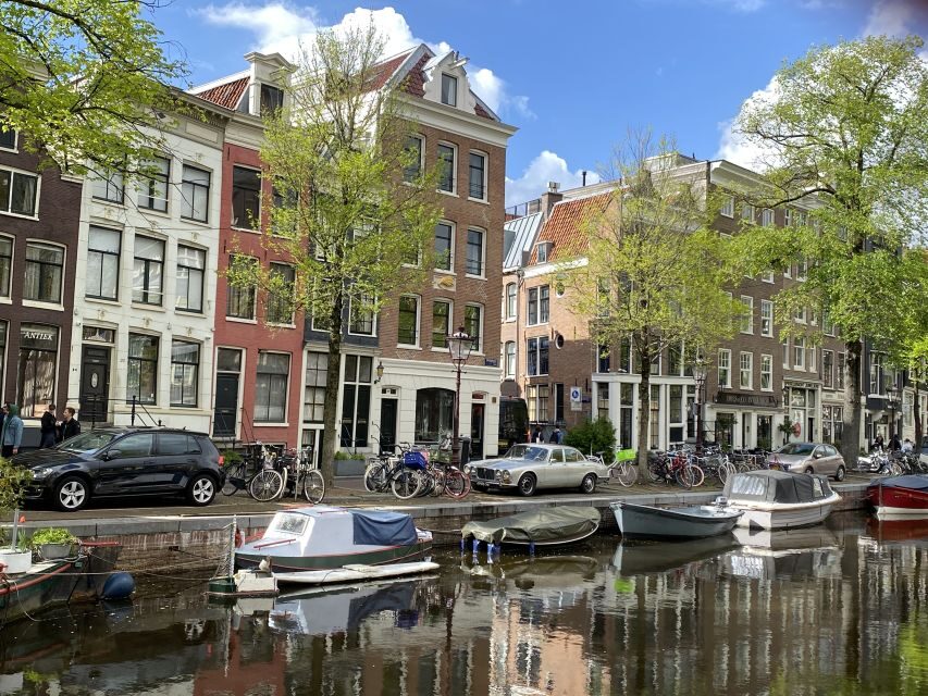 Amsterdam: Guided Off-The-Beaten-Track Walking Tour - Torensluis and the Canal Belt Story You Can See in Real Life