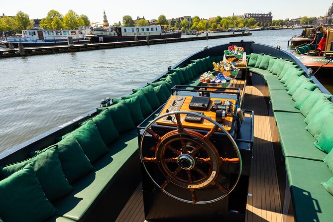 Amsterdam: Guided Open Boat Canal Cruise Unlimited Drinks Option - Key things that make this canal cruise worth your attention