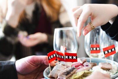 Amsterdam High-End Dutch Food & History Tour - Up to 8 guests - The food lineup: apple pie, cheeses, sausages, seafood, and the bitterballen finale