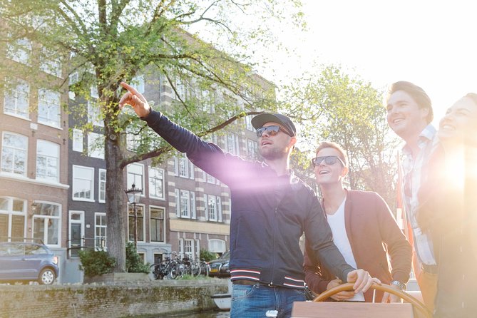 Amsterdam Highlights Canal Cruise with a Drink - Onboard comfort: classic wooden boat, small groups, and real privacy