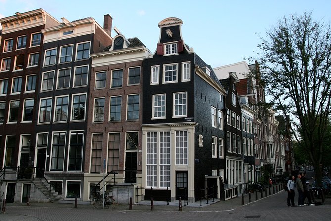 Amsterdam Highlights Walking Tour: Small Group Experience - Dam Square: the center of gravity for Amsterdam’s big eras