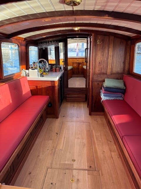 Amsterdam: Historic Boat Cruise with open bar and nibbles - A 1911 Salon Boat Cruise With Real-World Amsterdam Comfort