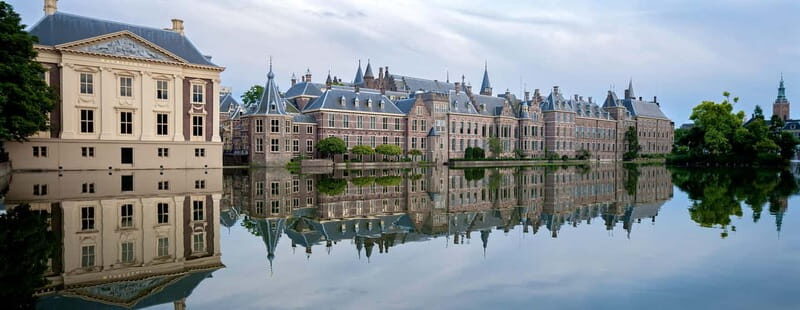 Amsterdam: Kinderdijk, Euromast, Delft and Den Haag Day Tour - Delft on foot without the overload: canals, gables, and medieval towers