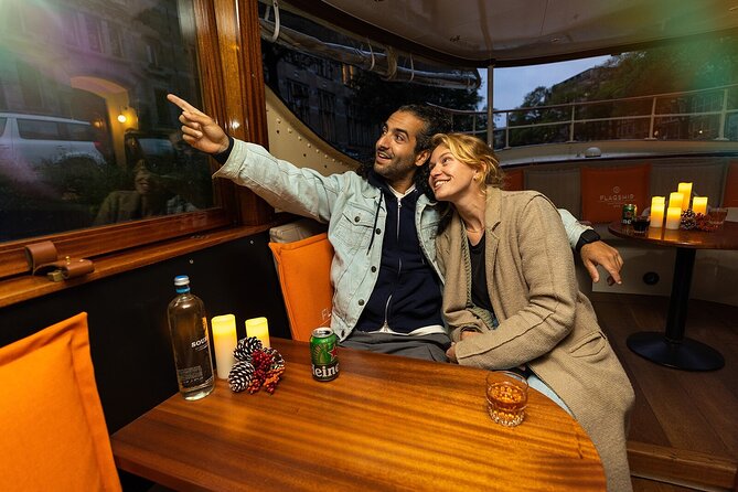 Amsterdam Light Festival: Heated Cruise with Hot Drinks & Bite - Inside the saloon: views, heat, and the reality of crowded boats