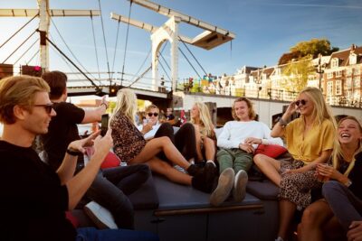 Amsterdam Light Festival: Saloon Boat Cruise + Hot Drinks & Bite - Boarding near the National Maritime Museum: timing and your spot