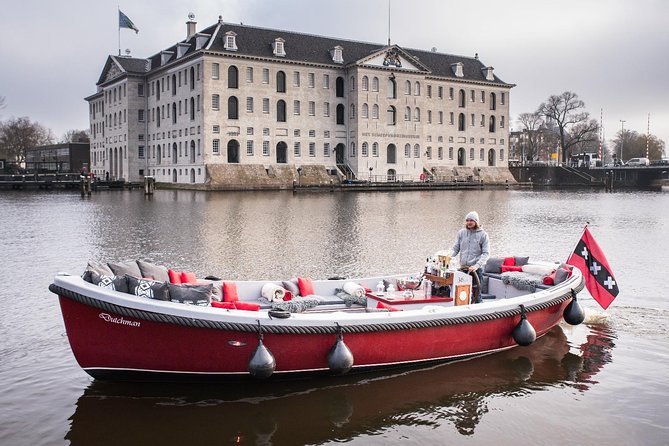 Amsterdam Light Festival: Saloon Boat Cruise + Hot Drinks & Bite - Following the light artworks along the UNESCO Canal Ring