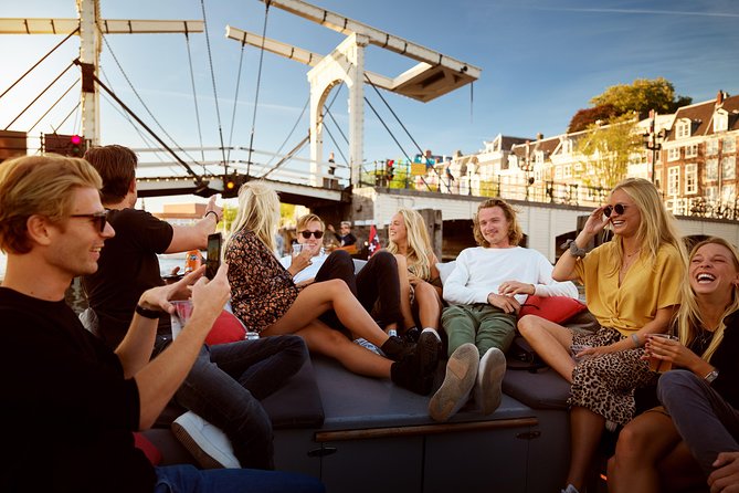 Amsterdam Light Festival: Saloon Boat Cruise + Hot Drinks & Bite - Boarding near the National Maritime Museum: timing and your spot