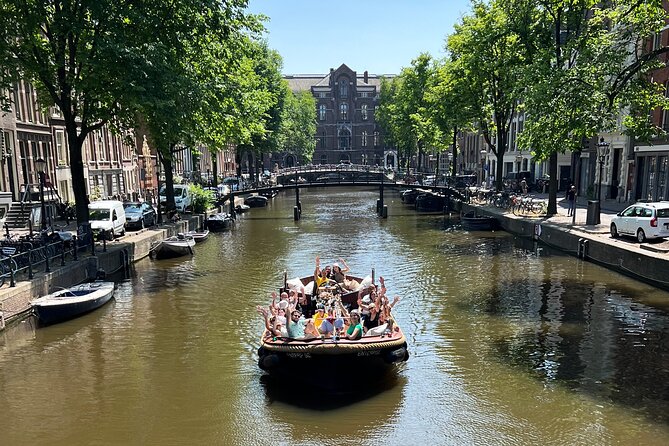 Amsterdam Luxury Boutique Boat tour with Unlimited Beer and Wine - Price and value: $18.04 for a guided canal ride with drinks