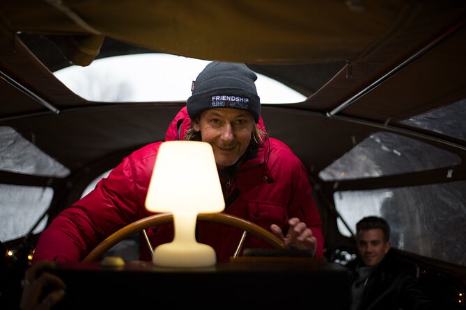Amsterdam: Luxury Light Festival Cruise Unlimited Drinks Included - Boat cover reality check: warmth and visibility in rain