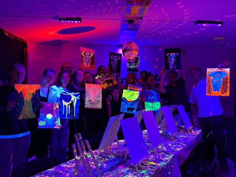 Amsterdam: Paint and Sip in the Dark at Rembrandt van Wine - Neon painting in the dark: what the experience really feels like
