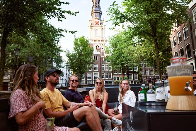 Amsterdam Private Boat Trip with Pizza and Unlimited Drinks - From lively canals to narrow streets and Oudeschans tower
