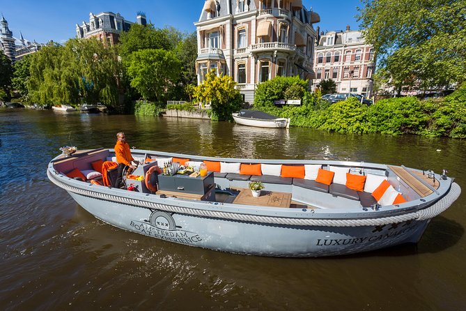 Amsterdam Private Boat Trip With Skipper, Burger and Beers - The art-and-architecture stretch: church bell views and Hermitage Amsterdam