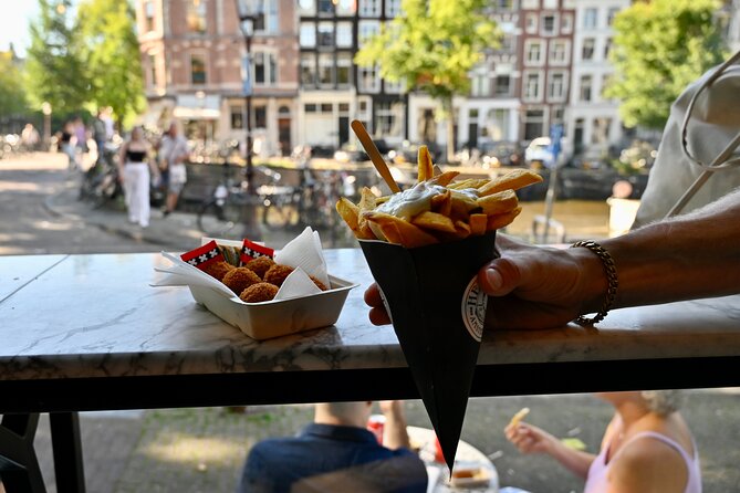 Amsterdam Private Food & Drinks Tour by UNESCO Canals & Jordaan - Flower Market, Spui University, and the kind of places locals actually use