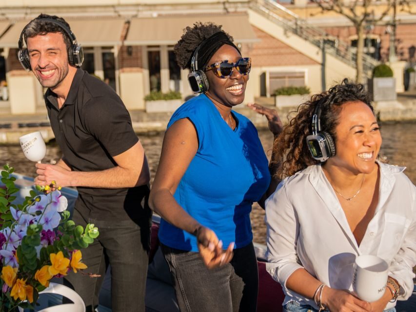 Amsterdam: Private Luxury Cruise with Drinks & Silent Disco - A luxury open boat on Amsterdam’s canals (and where you meet)