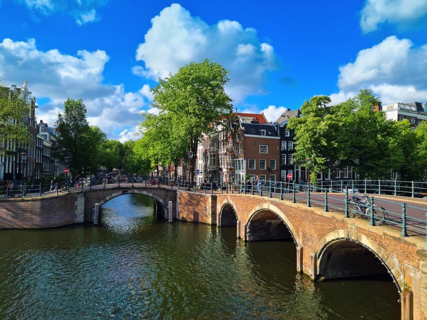Amsterdam: Private Pedicab Historical Sightseeing Tour - Zeedijk and Nieuwmarkt: dike defenses, old interiors, and the city gate in the middle