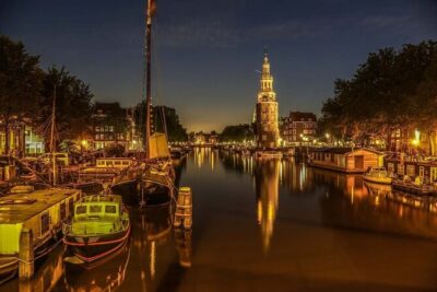 Amsterdam: Private Romantic Evening Canal Cruise + Bubbles/Snacks - Amsterdam after dark: quiet canals, lit buildings, and that slow pace