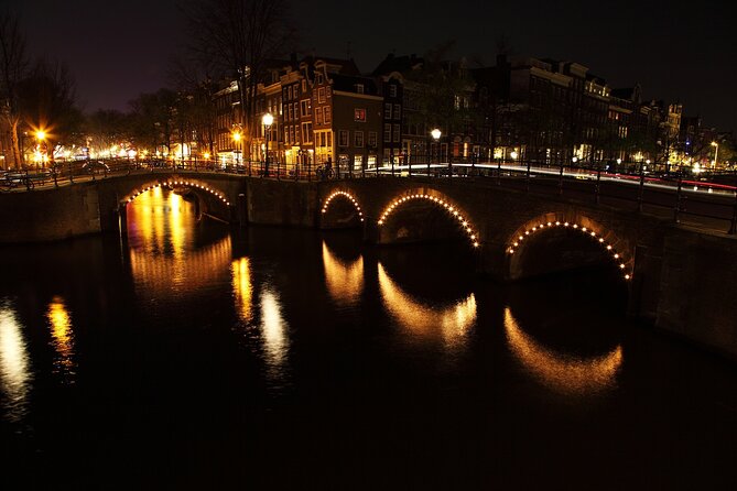 Amsterdam: Private Romantic Evening Canal Cruise + Bubbles/Snacks - Torensluis Bridge (completed 1648) and Amsterdam’s “smallest things”