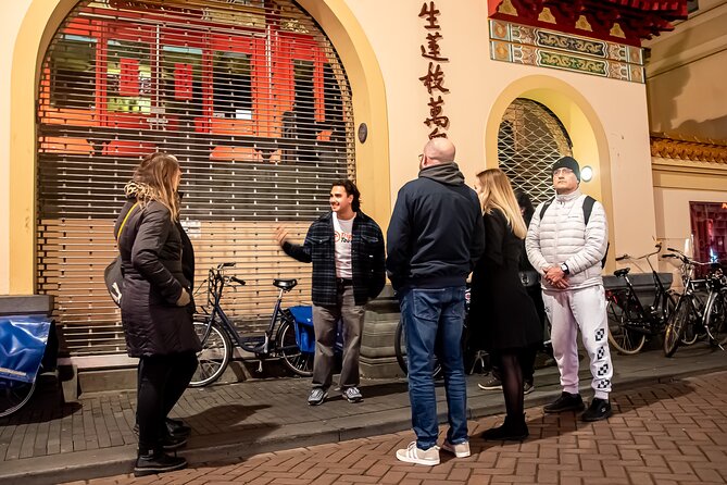 Amsterdam Red Light District and City Center Walking Tour - Pub The Ape (Int Aepjen): Wooden Buildings and a Lesson from a Fire
