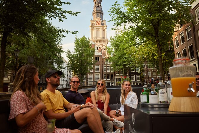 Amsterdam: Saloon Boat Cruise + Unlimited Drinks & Bite option - Zuiderkerk, the Dutch National Opera, and the Stopera building