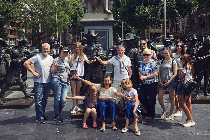 Amsterdam Sightseeing Tour + Hidden Gems + Tastings + PDF guide - Bloemenmarkt and Munttoren: flowers, symbols, and a finance twist