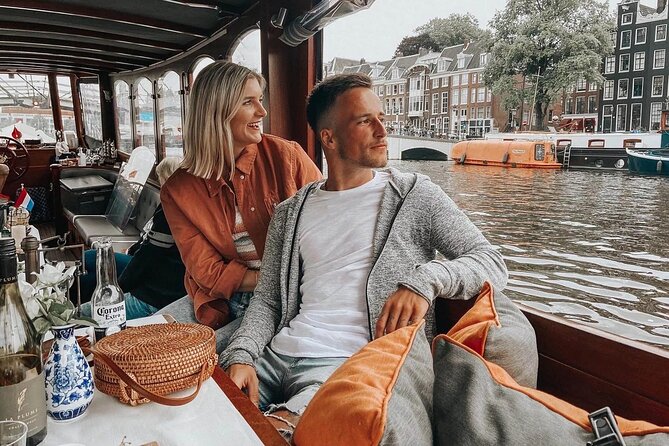 Amsterdam Small-Group Bike Tour With Canal Cruise, Drinks, Cheese - De Gooyer Windmill, ARTIS edges, and a narrow bridge ride